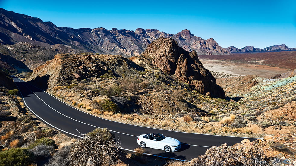 Self drive holiday in Tenerife: BMW Z4 driving past volcano